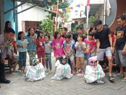 Merayakan Kemerdekaan RI ke-78, Bhabinkamtibmas Pattunuang Berikan Pengamanan Lomba Balap Karung